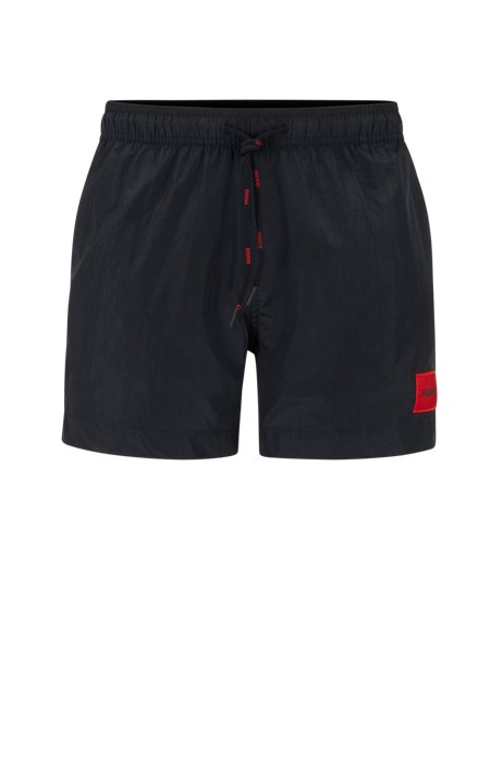 Quick-drying swim shorts with red logo label, Black
