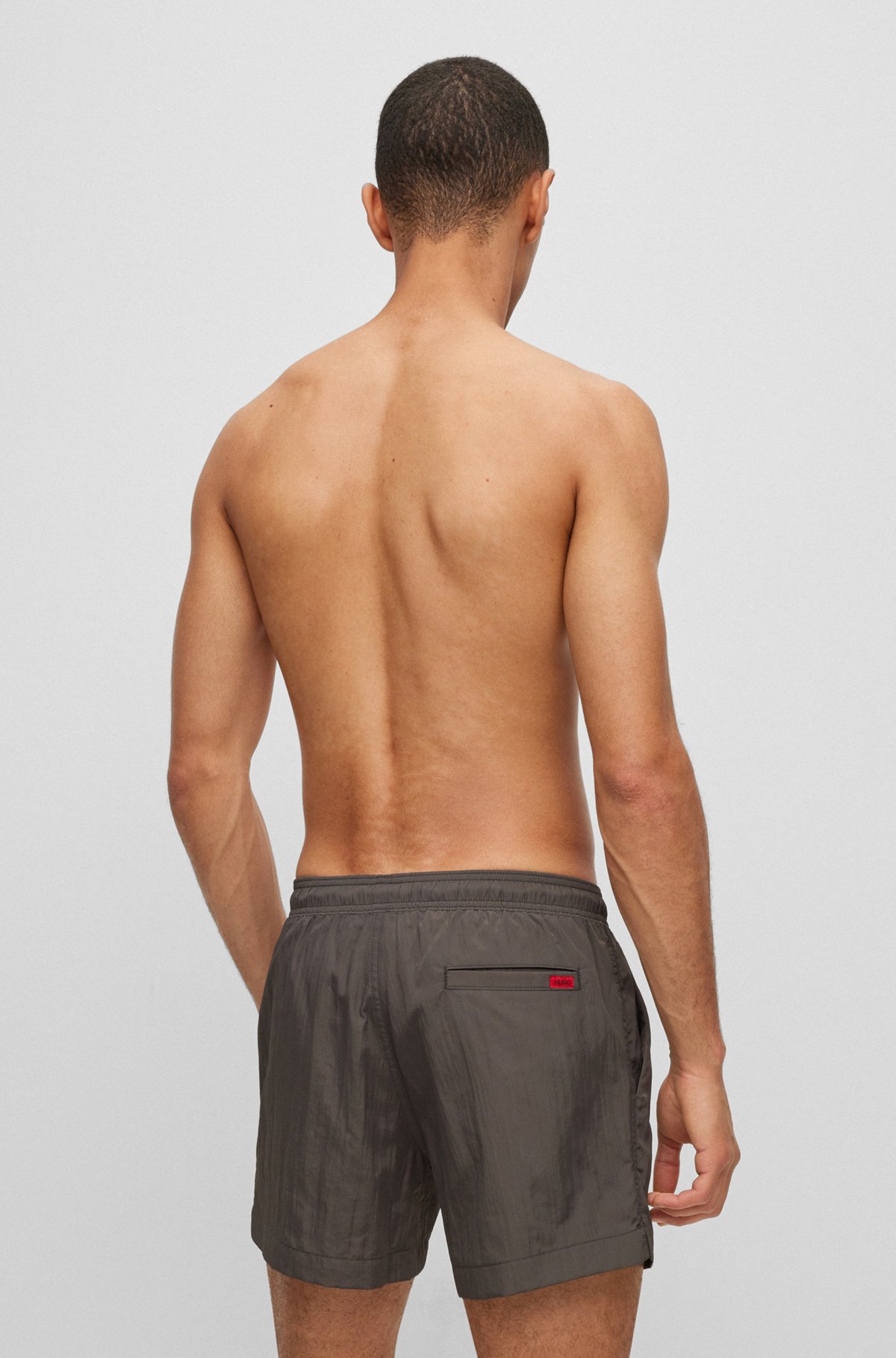Quick-dry swim shorts with red logo label, Dark Grey