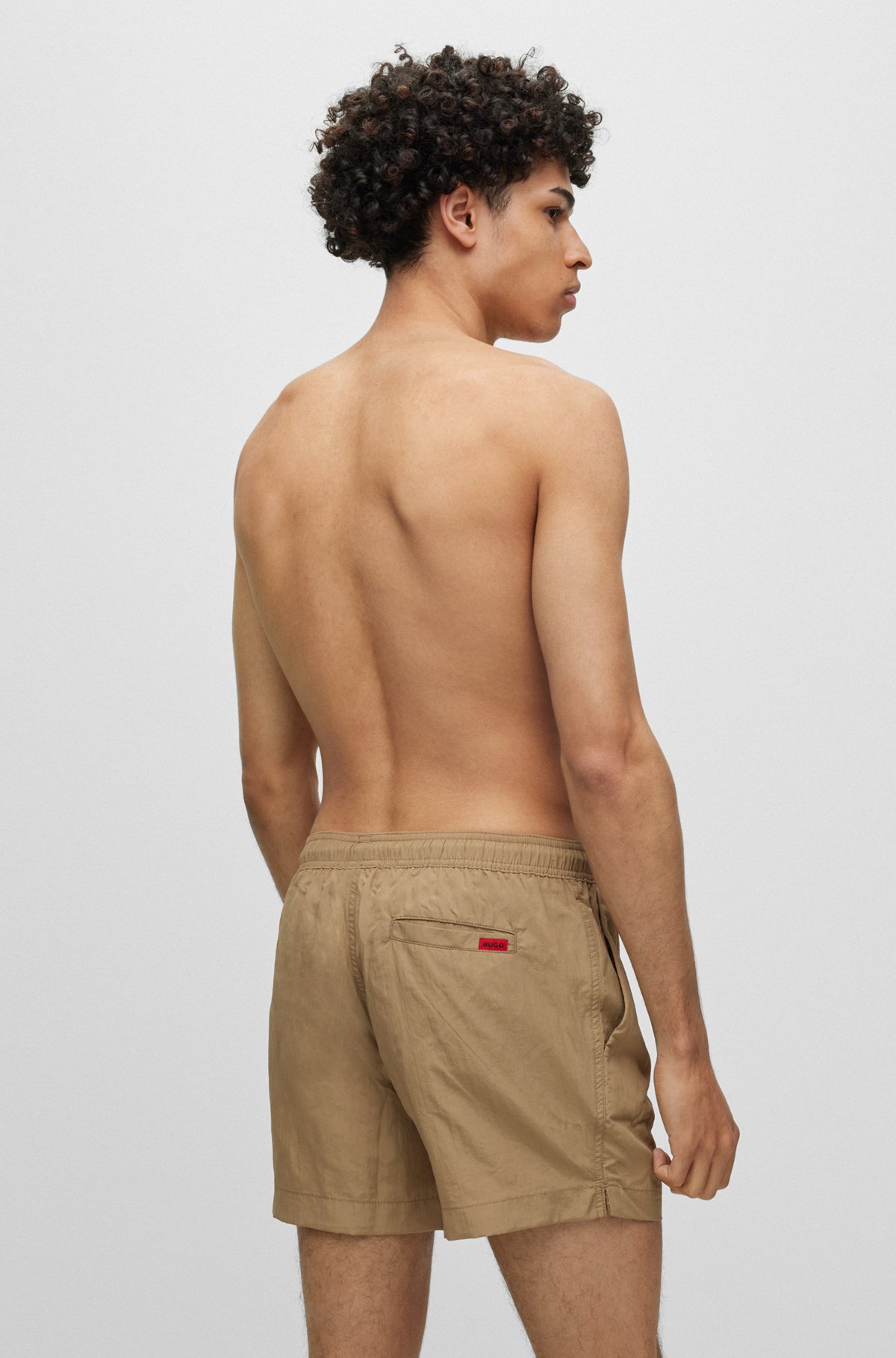 Quick-dry swim shorts with red logo label, Light Brown
