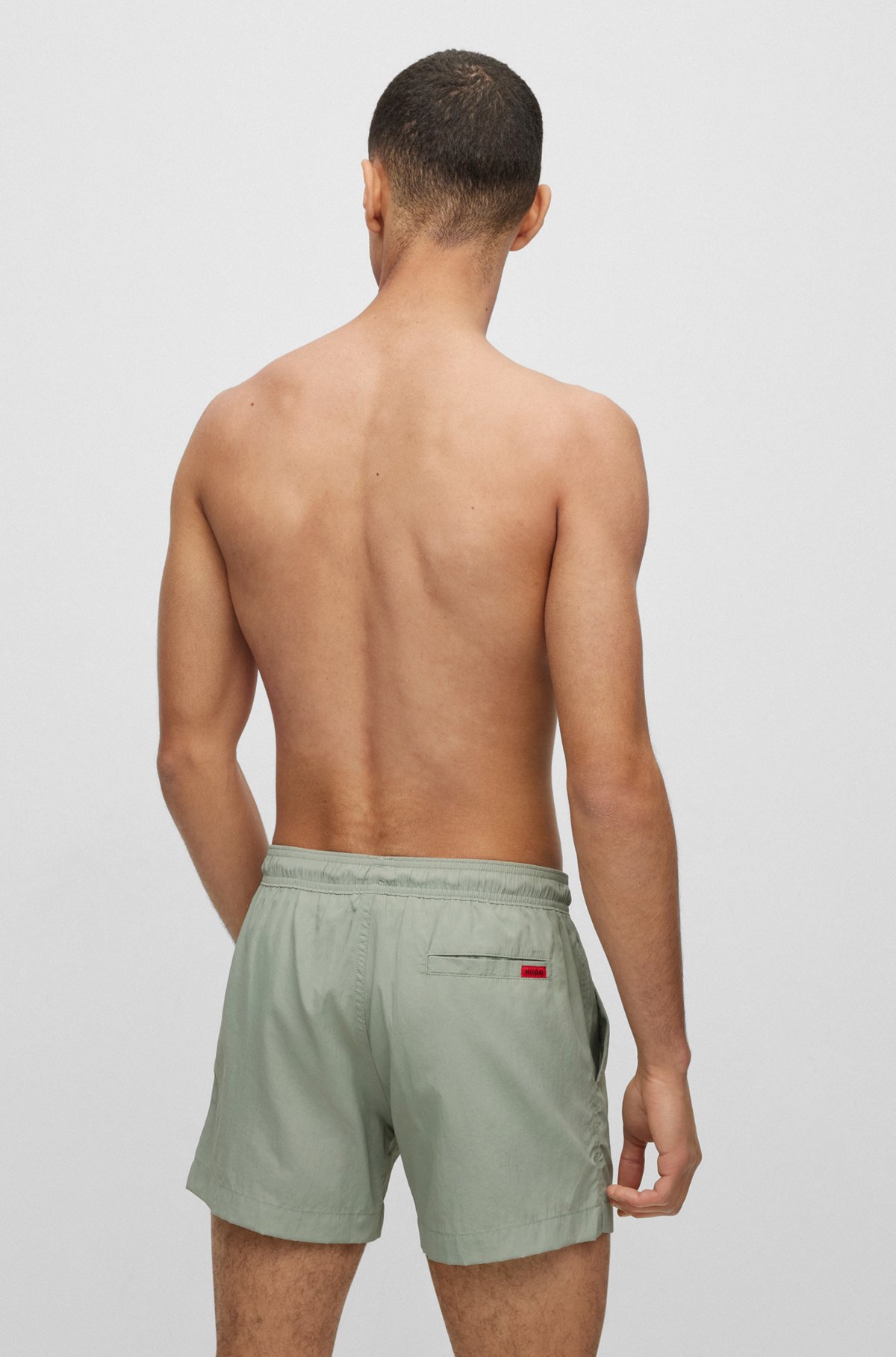 Quick-dry swim shorts with red logo label, Light Green