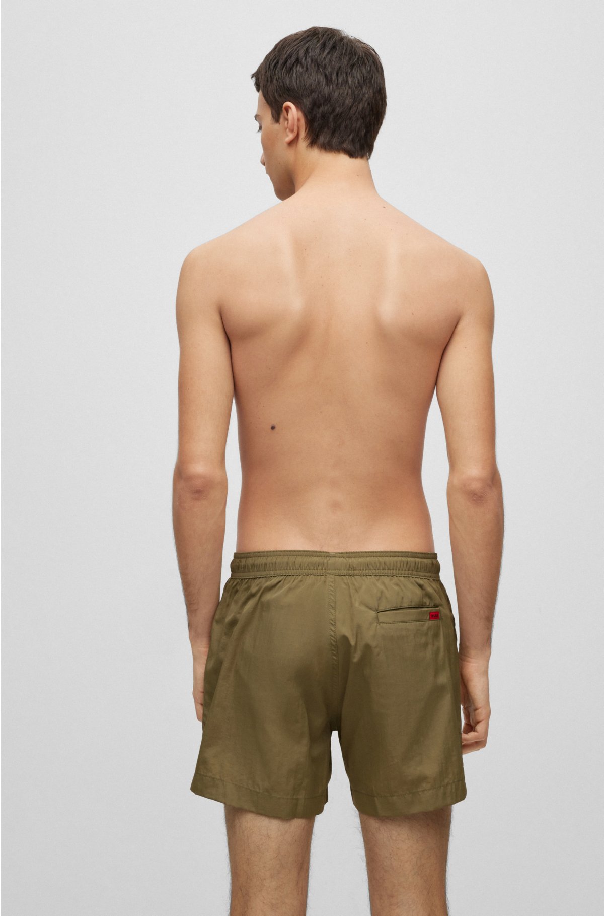 Quick-dry swim shorts with red logo label, Green