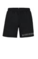Recycled-material swim shorts with repeat logos, Black