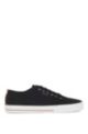 Low-top canvas trainers with signature stripe, Black