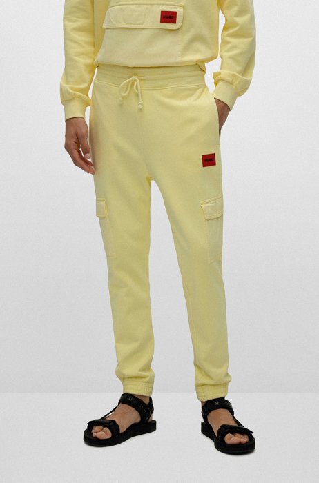 Cotton-terry cargo tracksuit bottoms with red logo label, Light Yellow