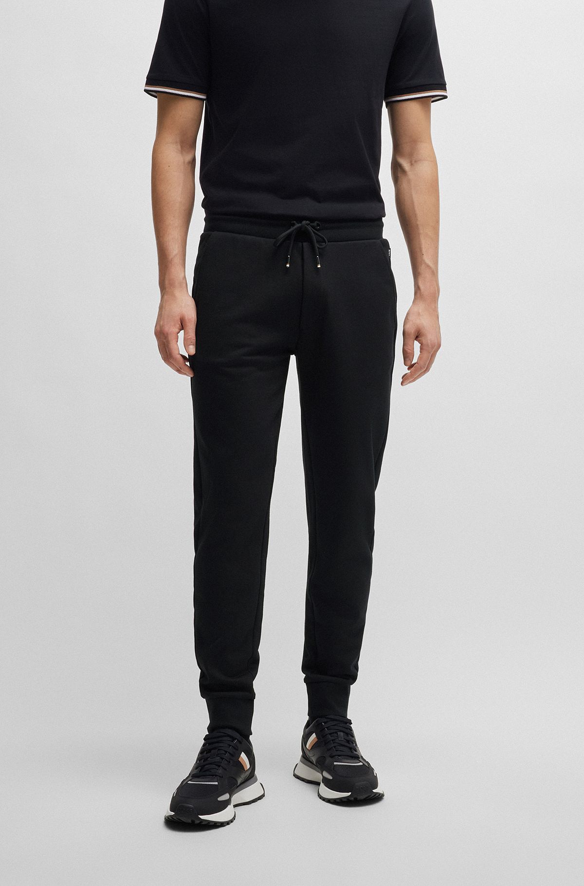 Cotton-terry tracksuit bottoms with rubber-print logo, Black