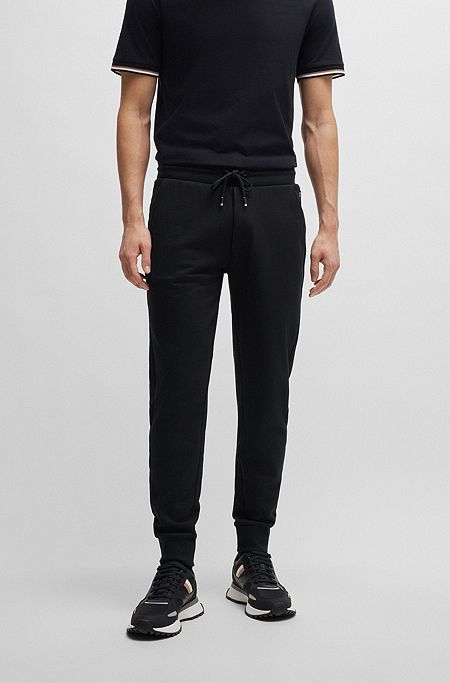 Pantaloni della tuta in terry di cotone con logo stampato in gomma, Nero