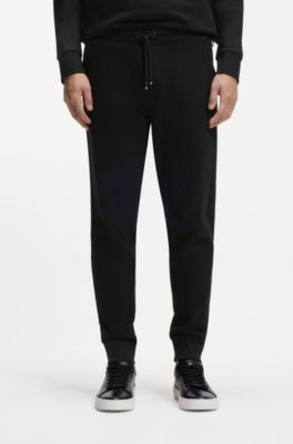 Cotton-terry tracksuit bottoms with printed logo, Black