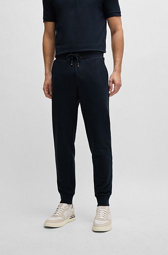 Cotton-terry tracksuit bottoms with rubber-print logo, Dark Blue
