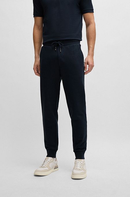 Tracksuit-bukser i bomuldsfrotté med gummiprintet logo, Mørkeblå