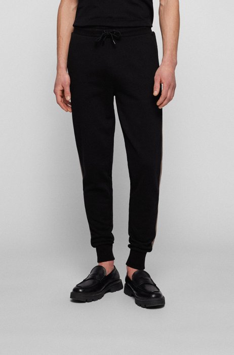 Pantalones de chándal regular fit con apliques en las costuras laterales, Negro