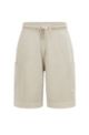 Garment-dyed shorts van katoenen sweatstof met opgezette zakken, Lichtbeige