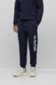 Cuffed tracksuit bottoms in French terry with contrast logo, Dark Blue