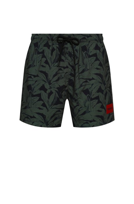 Leaf-print swim shorts with red logo label, Khaki