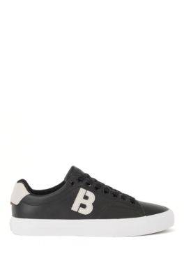 low top black trainers