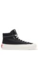 High-top rubber-bumper trainers with red logo label, Black