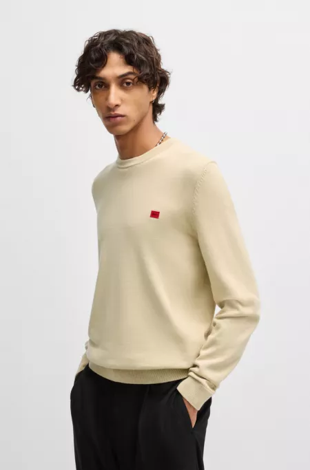 Cotton sweater with red logo label