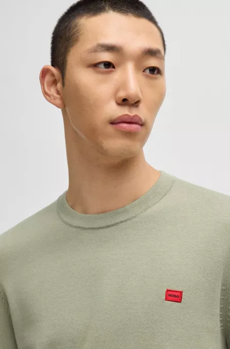 Cotton sweater with red logo label