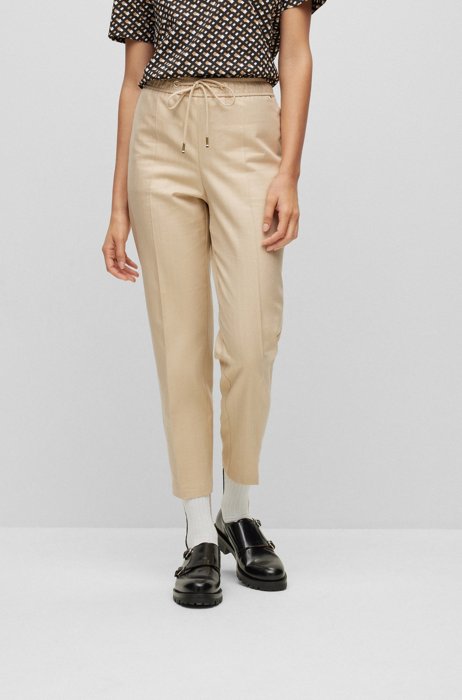 Relaxed-fit trousers in herringbone flannel with tapered leg, Beige