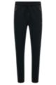 Drawstring tracksuit bottoms in stretch fabric with printed coordinates, Black