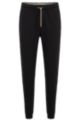 Cotton-blend tracksuit bottoms with logo-tape inserts, Black