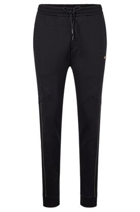 Cotton-blend tracksuit bottoms with grid artwork