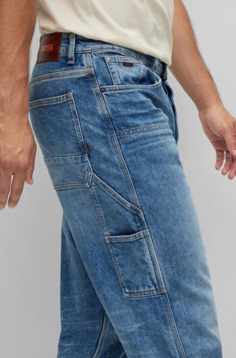 Jeans con fit affusolato in denim rigido con logo stampato HUGO BOSS Uomo Abbigliamento Pantaloni e jeans Jeans Jeans affosulati 