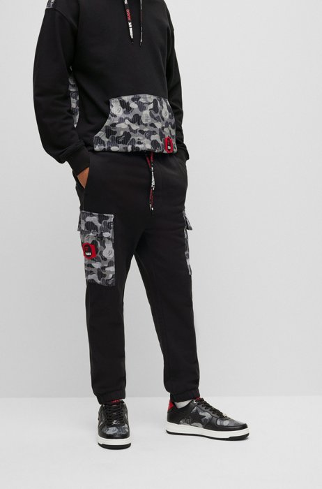 Cotton-jersey tracksuit bottoms with camouflage pattern , Black