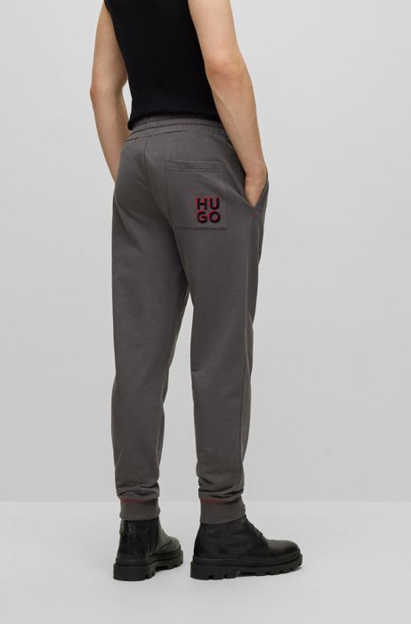 Pantaloni della tuta in terry di cotone con logo scomposto HUGO BOSS Uomo Abbigliamento Abbigliamento per la notte Loungewear 