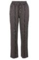 Relaxed-fit trousers in monogram-print fabric, Black Patterned