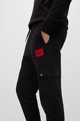 HUGO Relaxed fit tracksuit bottoms with red logo label