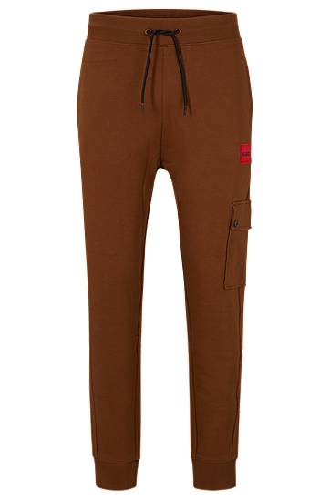 Relaxed-fit tracksuit bottoms with red logo label, Hugo boss