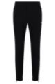 Tapered-fit trousers in water-repellent stretch fabric, Black
