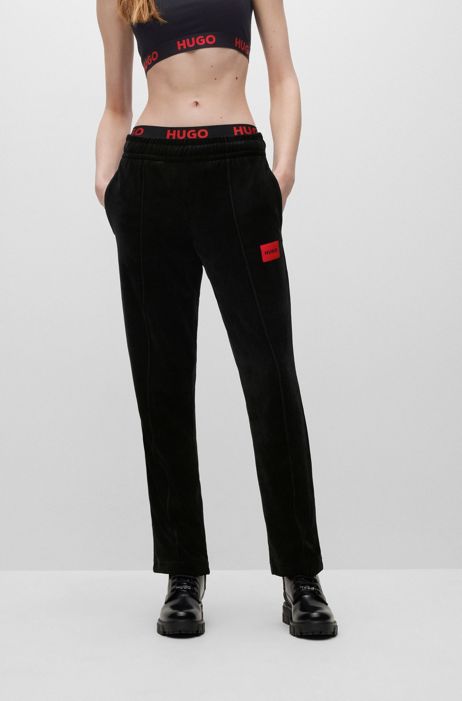 Pantaloni della tuta in velluto con etichetta con logo rossa HUGO BOSS Donna Abbigliamento Pantaloni e jeans Pantaloni Pantaloni in velluto 
