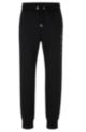Cotton-terry tracksuit bottoms with monogram-filled logo, Black