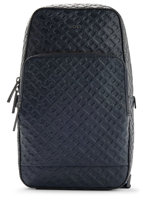 Grained-leather mono-strap backpack with embossed monograms, Dark Blue