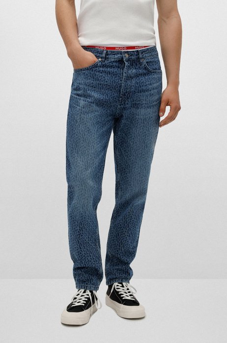 Jeans con fit affusolato in denim rigido con logo stampato, Blu a motivi