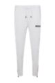 Logo tracksuit bottoms with signature stripes and cuffed hems, White