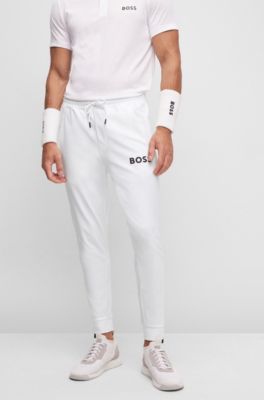 Hugo Boss BOSS x Matteo Berrettini logo tracksuit bottoms with signature stripes and cuffed hems. 1