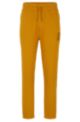 Jogginghose aus Bio-Baumwolle mit Beinbündchen und Stack-Logo, Orange