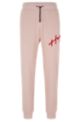 Cotton-terry tracksuit bottoms with handwritten logo embroidery, light pink