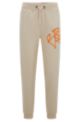 Cotton-terry tracksuit bottoms with graffiti-style artwork, Light Beige