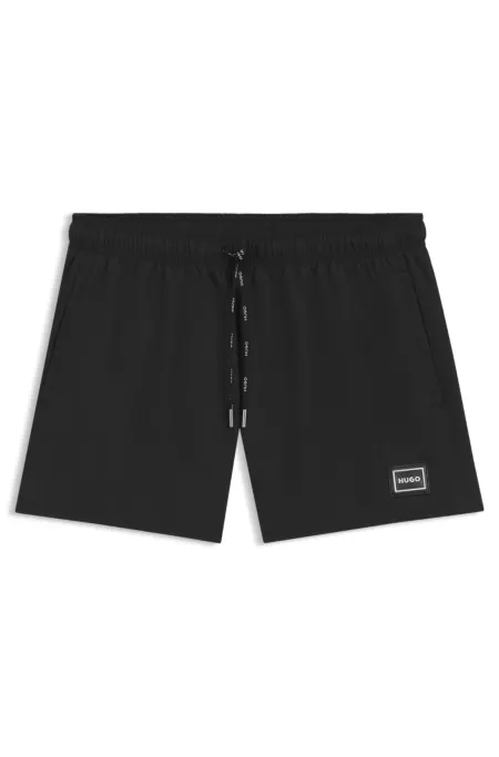 Short de bain avec logo en métal et cordon logoté