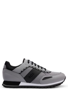 - Running-style trainers with leather and mesh