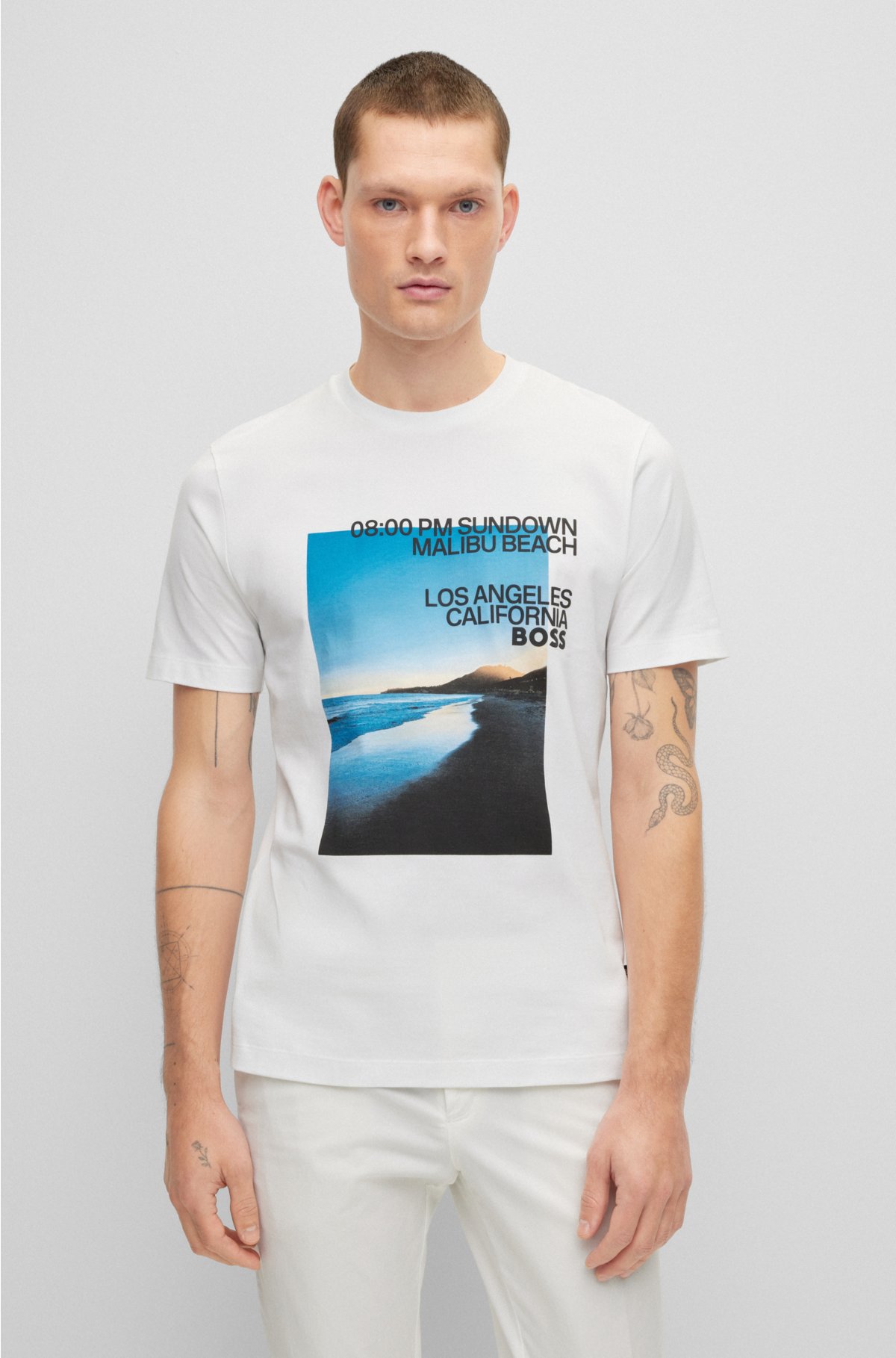 - T-shirt bomuldsblanding med et fotografisk strandtryk samt logo