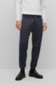 Monogram-print tracksuit bottoms with signature-stripe tape, Blue Patterned