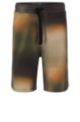 Cotton-terry shorts with bleach-effect camouflage print, Patterned