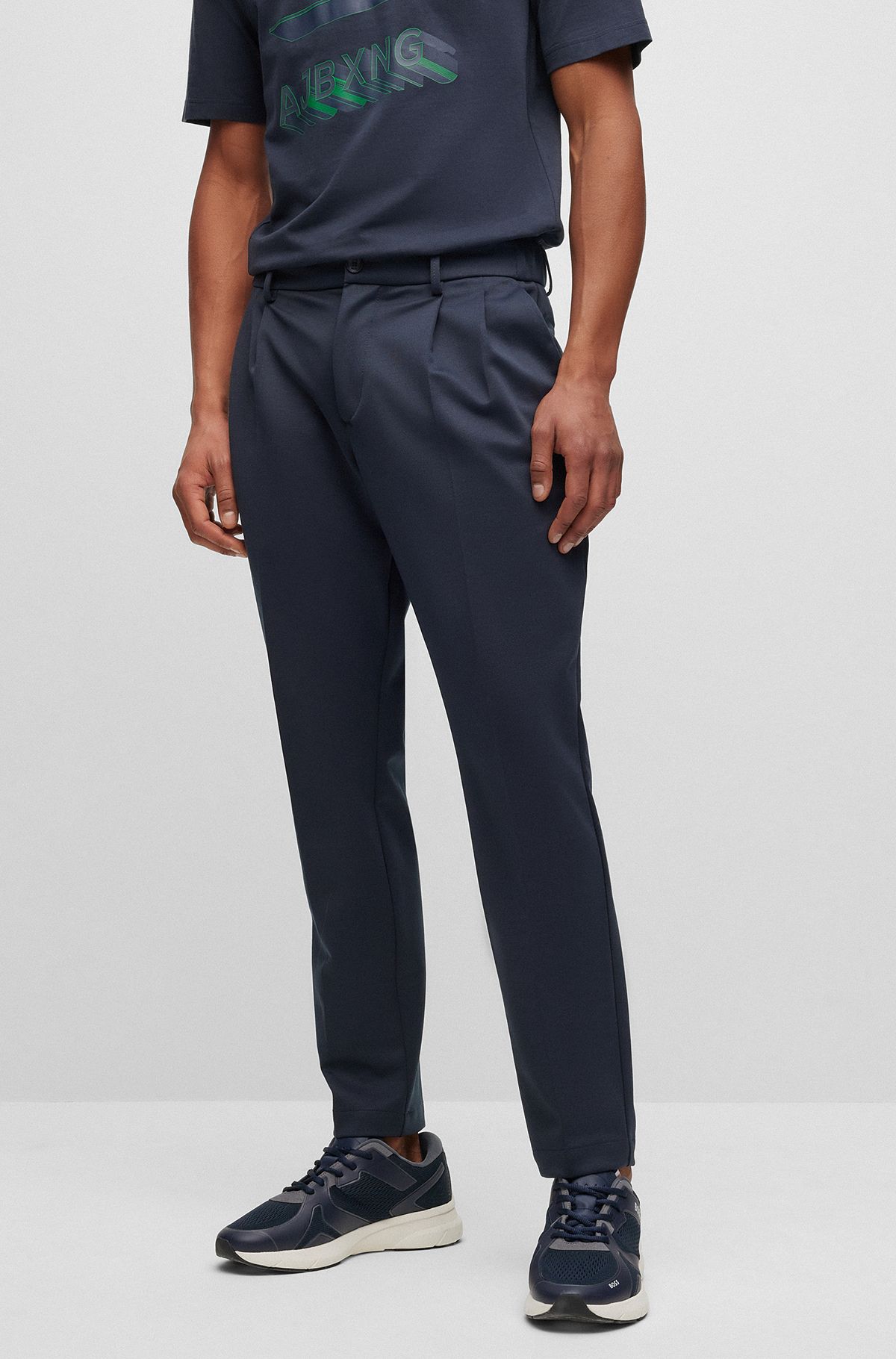 BOSS x AJBXNG tapered-fit trousers in stretch jersey with front pleats, Dark Blue