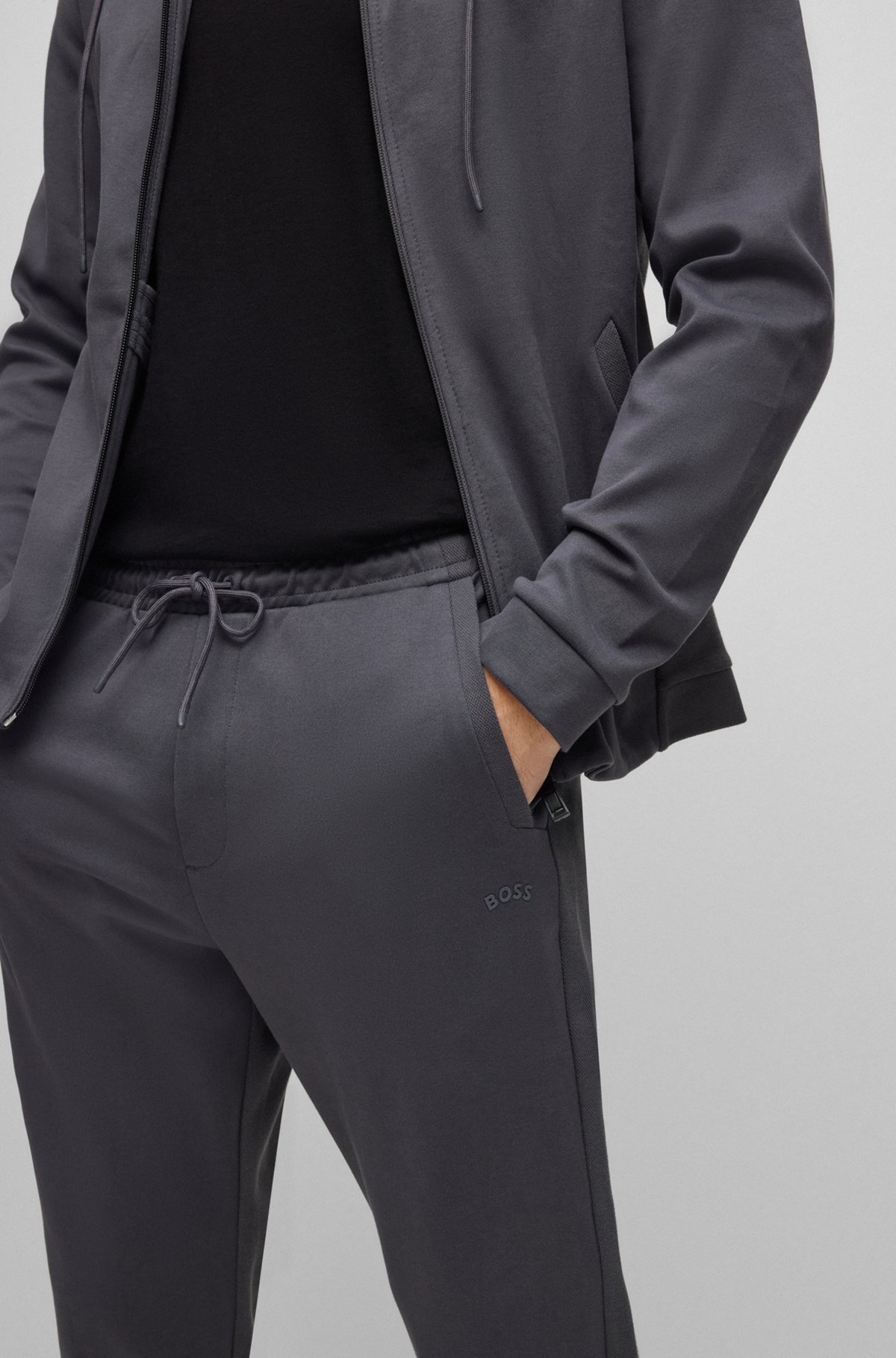 Interlock-cotton tracksuit bottoms with curved logo, Dark Grey
