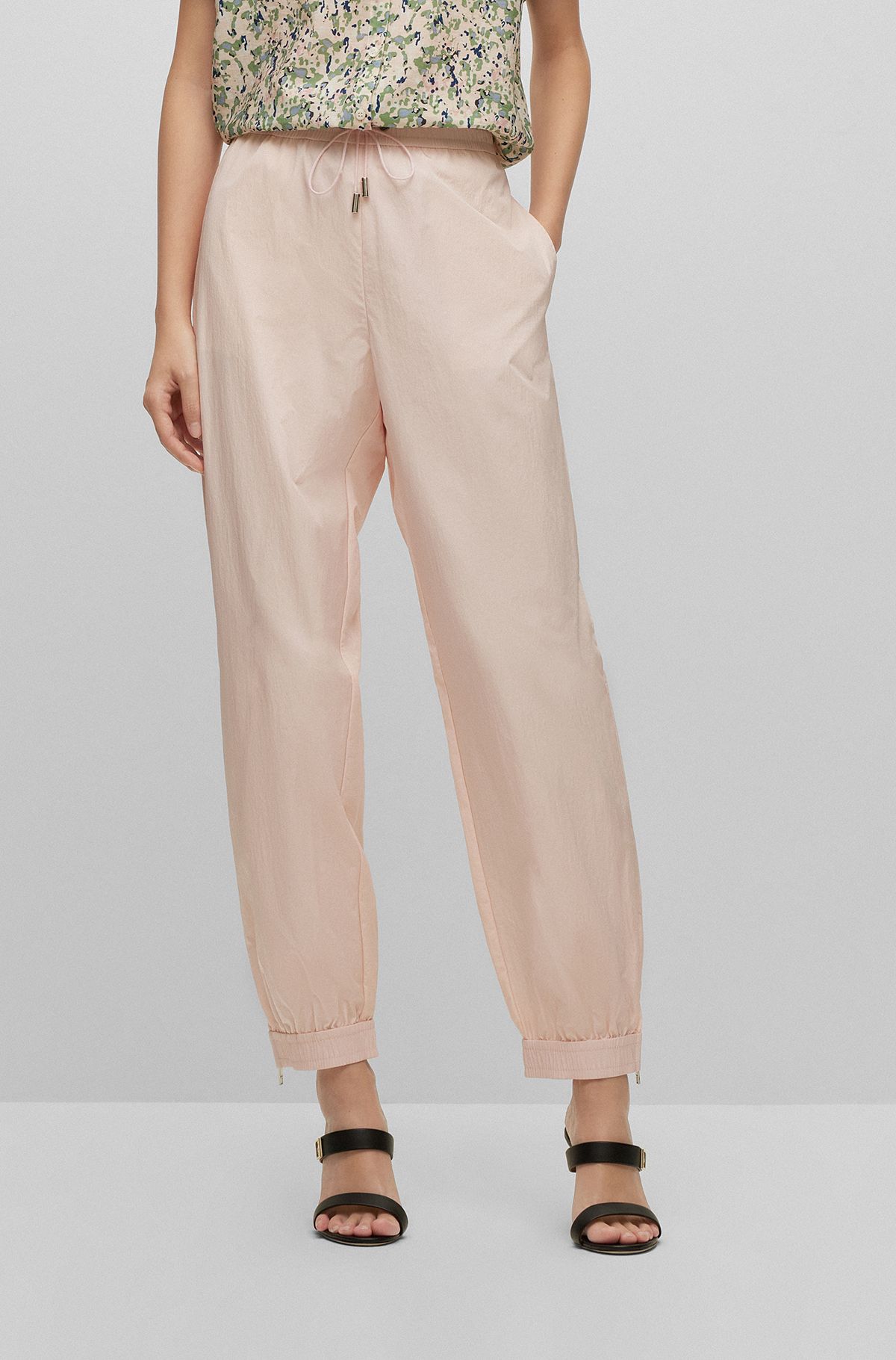 Relaxed-fit tracksuit bottoms with zipped hems, Pink