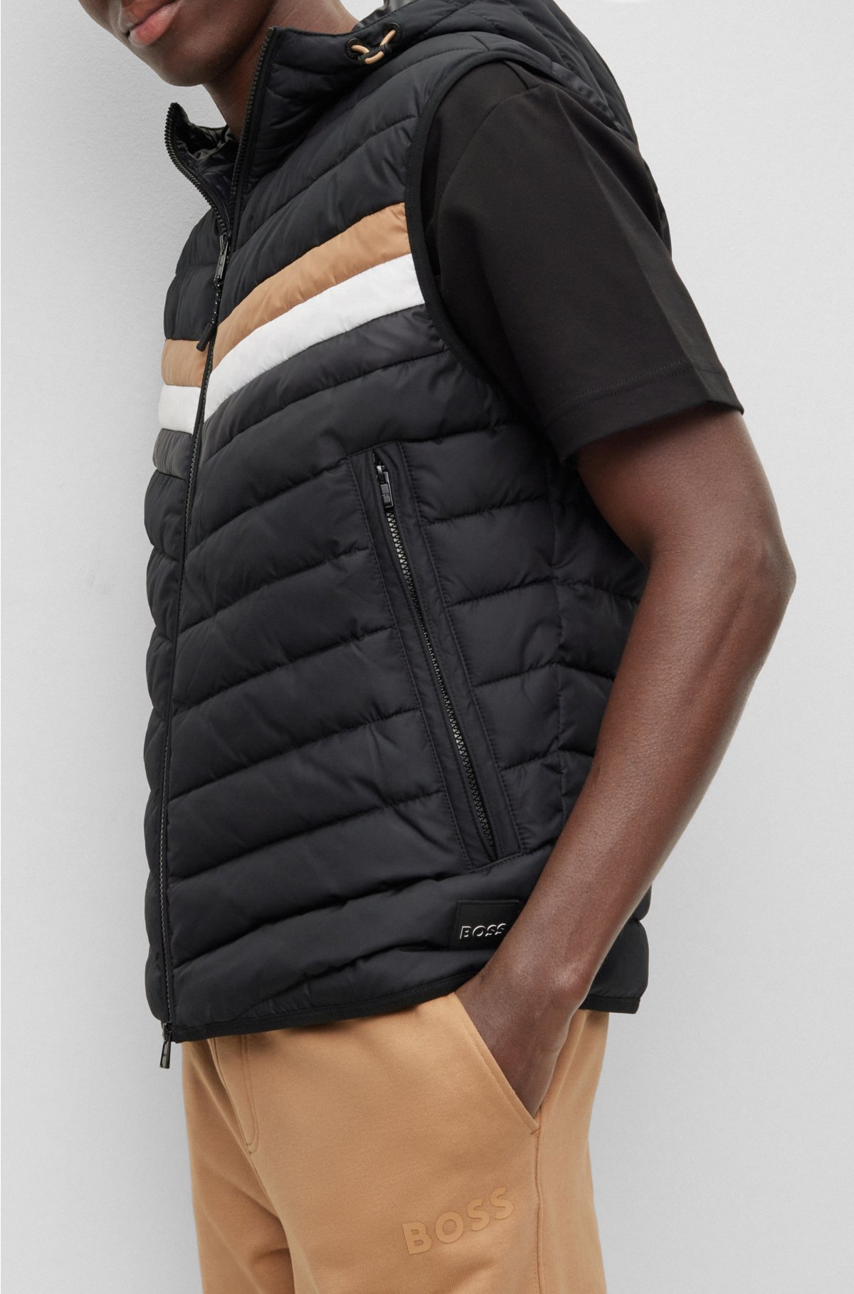- Water-repellent hooded gilet with stripe